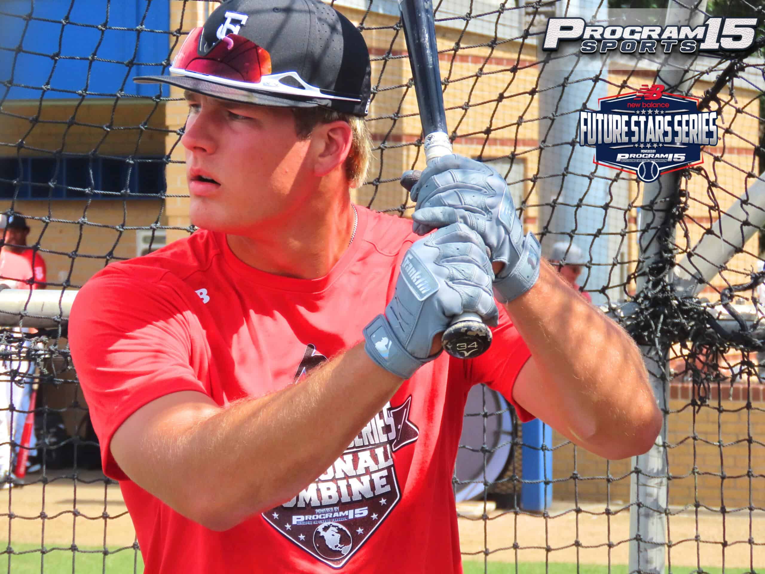 Young baseball player at Future Stars Series event with bat and helmet.